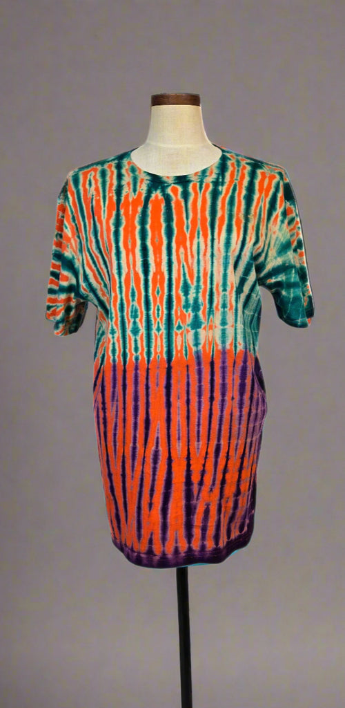 Colorful tie-dye dress on a mannequin against a white background